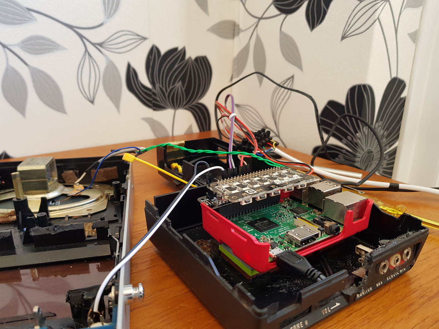  Raspberry Pi and pHAT BEAT are placed inside an old cassette player wired to the intercom outside. The pHAT BEAT is also connected to the player’s original speaker so that speech and the chime can be heard